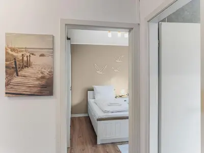 Ein Bett oder Betten in einem Zimmer der Unterkunft Objekt-Nr 7 - Hafen - Rose