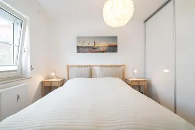 Ein Bett oder Betten in einem Zimmer der Unterkunft Wohnung 10