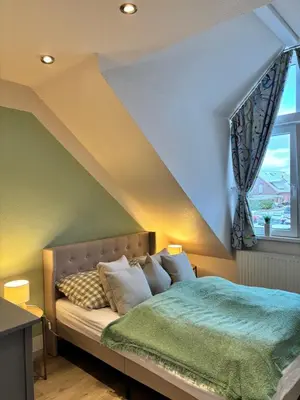Ein Bett oder Betten in einem Zimmer der Unterkunft 4 Zimmer Ostseetraum