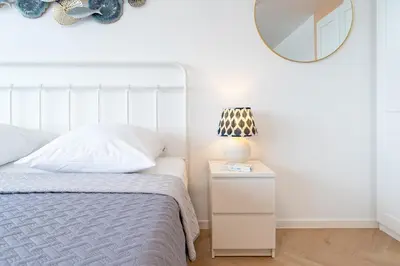 Ein Bett oder Betten in einem Zimmer der Unterkunft Strandhotel Scharbeutz Oceanview Deluxe