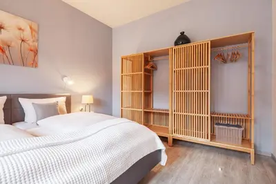 Ein Bett oder Betten in einem Zimmer der Unterkunft Gästehaus Daheim - Appartement 03