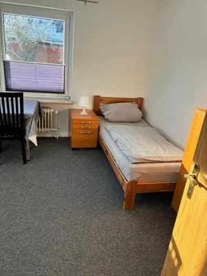 Ein Bett oder Betten in einem Zimmer der Unterkunft Freundliche Monteurwohnung