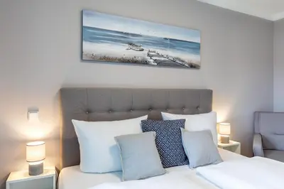 Ein Bett oder Betten in einem Zimmer der Unterkunft Godewindpark Travemünde Exklusives Apartment 3-12