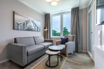Ein Sitzbereich in der Unterkunft Godewindpark Travemünde Exklusives Apartment 3-12