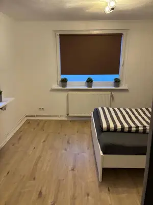 Ein Bett oder Betten in einem Zimmer der Unterkunft Schlafen in Lübeck