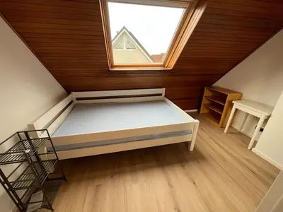 Ein Bett oder Betten in einem Zimmer der Unterkunft Familiennest