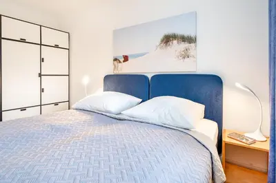 Ein Bett oder Betten in einem Zimmer der Unterkunft Haus Carpe Diem Strandnest