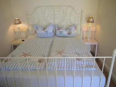 Ein Bett oder Betten in einem Zimmer der Unterkunft Strandperle 1 Timmendorfer Strand