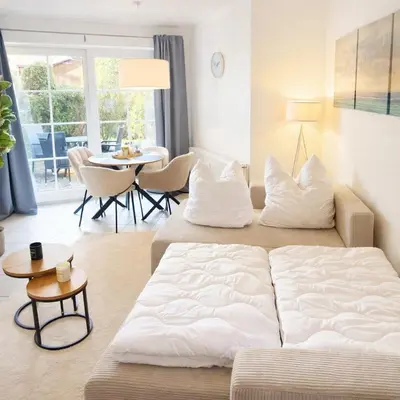 Ein Bett oder Betten in einem Zimmer der Unterkunft PrimeLoft Seebrücke - Sonne, Strand & Meer - Terasse - Parkplatz - 200m zum Strand