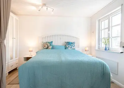 Ein Bett oder Betten in einem Zimmer der Unterkunft Ferienbungalow Kleine Hummelkate
