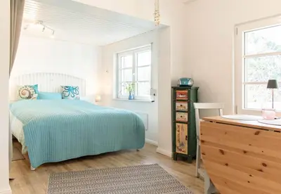 Ein Bett oder Betten in einem Zimmer der Unterkunft Ferienbungalow Kleine Hummelkate