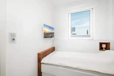 Ein Bett oder Betten in einem Zimmer der Unterkunft Alsterlodge
