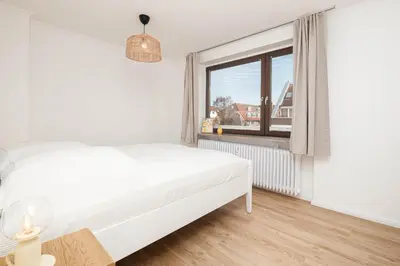 Ein Bett oder Betten in einem Zimmer der Unterkunft Haus Boy, Penthouse Nr 11
