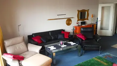 Ein Sitzbereich in der Unterkunft Strandallee 50, Ferienwohnung mit direktem Meerblick