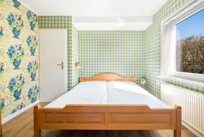 Ein Bett oder Betten in einem Zimmer der Unterkunft Ferienidyll Mariett