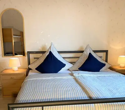 Ein Bett oder Betten in einem Zimmer der Unterkunft Haus Am Strande
