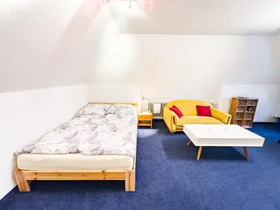 Ein Bett oder Betten in einem Zimmer der Unterkunft TraveNah