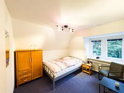Ein Bett oder Betten in einem Zimmer der Unterkunft TraveNah
