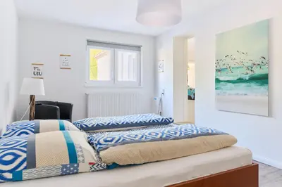 Ein Bett oder Betten in einem Zimmer der Unterkunft House family idyll Moba-travel