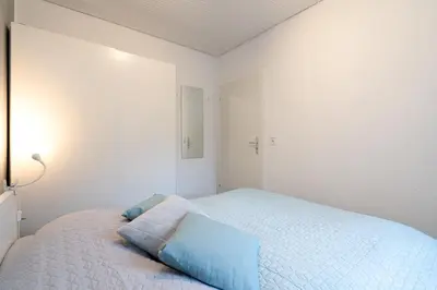 Ein Bett oder Betten in einem Zimmer der Unterkunft Ferienhaus Seeweg Wohnung 1