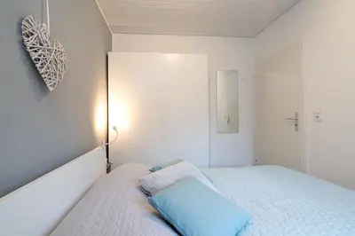 Ein Bett oder Betten in einem Zimmer der Unterkunft Ferienhaus Seeweg Wohnung 1