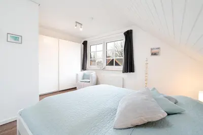 Ein Bett oder Betten in einem Zimmer der Unterkunft Ferienhaus Seeweg Wohnung 2