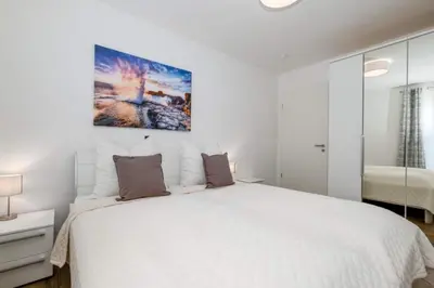 Ein Bett oder Betten in einem Zimmer der Unterkunft Strandperle #02