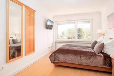 Ein Bett oder Betten in einem Zimmer der Unterkunft Gästehaus Nina #4