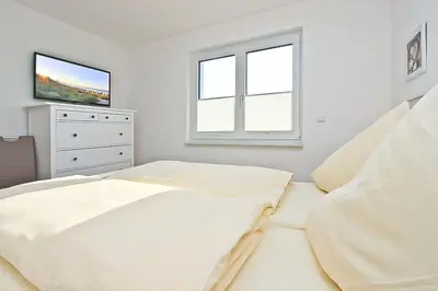 Ein Bett oder Betten in einem Zimmer der Unterkunft Strandzeit #6