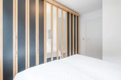Ein Bett oder Betten in einem Zimmer der Unterkunft Domizil Strandburg App 6