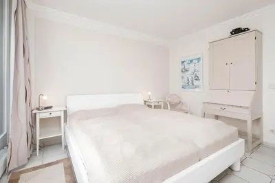 Ein Bett oder Betten in einem Zimmer der Unterkunft An der Waldkapelle, App 337