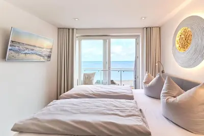 Ein Bett oder Betten in einem Zimmer der Unterkunft Sea View Suite