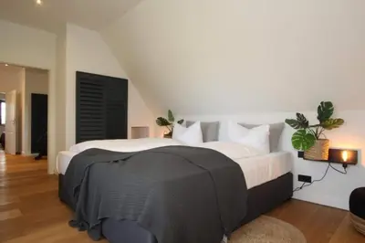 Ein Bett oder Betten in einem Zimmer der Unterkunft Reethüs am Schlossgut