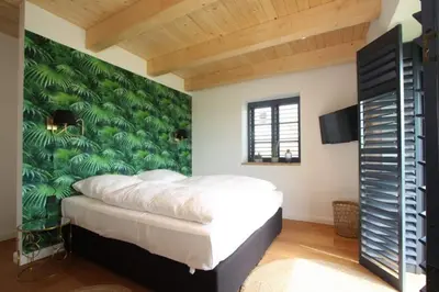 Ein Bett oder Betten in einem Zimmer der Unterkunft Reethüs am Schlossgut