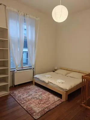 Ein Bett oder Betten in einem Zimmer der Unterkunft Gemütliches Zimmer, zentral & kinderfreundlich