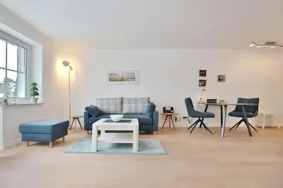 Ein Sitzbereich in der Unterkunft Modernes Strandhus Ostseeglück Appartement 303