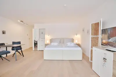 Ein Bett oder Betten in einem Zimmer der Unterkunft Modernes Strandhus Ostseeglück Appartement 303