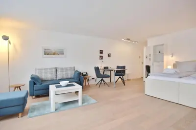Ein Sitzbereich in der Unterkunft Modernes Strandhus Ostseeglück Appartement 303