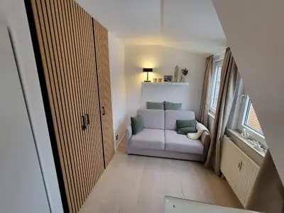 Ein Bett oder Betten in einem Zimmer der Unterkunft Ferienwohnung Wirbelwind