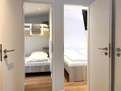 Ein Bett oder Betten in einem Zimmer der Unterkunft Ostseecamp Ferienhaus 