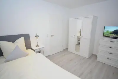 Ein Bett oder Betten in einem Zimmer der Unterkunft myOSTSEE Sailing Ferienwohnung
