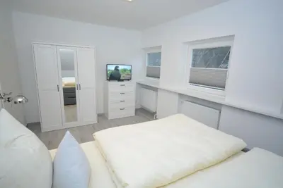Ein Bett oder Betten in einem Zimmer der Unterkunft myOSTSEE Sailing Ferienwohnung