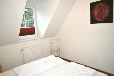 Ein Bett oder Betten in einem Zimmer der Unterkunft Ostseeallee 18 Ferienwohnung Muschelsucher