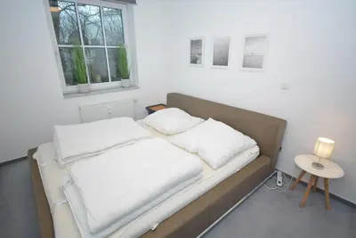 Ein Bett oder Betten in einem Zimmer der Unterkunft Modernes Wohlfühl-Appartement hochwertig & gepflegt