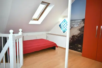 Ein Bett oder Betten in einem Zimmer der Unterkunft Ostseeallee 6 Ferienwohnung Treibholz