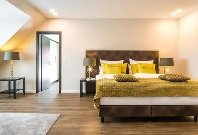 Ein Bett oder Betten in einem Zimmer der Unterkunft Strandhotel Luv
