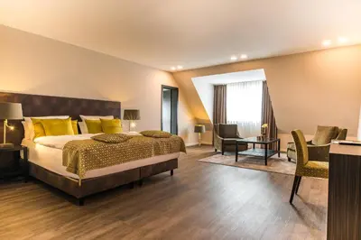 Ein Bett oder Betten in einem Zimmer der Unterkunft Strandhotel Luv