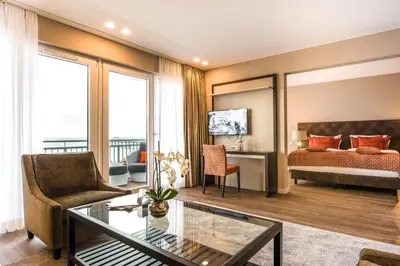 Ein Bett oder Betten in einem Zimmer der Unterkunft Strandhotel Luv