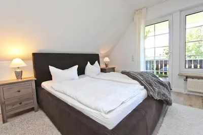 Ein Bett oder Betten in einem Zimmer der Unterkunft Ferienhaus Ostseerausch