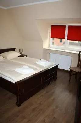 Ein Bett oder Betten in einem Zimmer der Unterkunft Der Gutschmecker Bad Segeberg